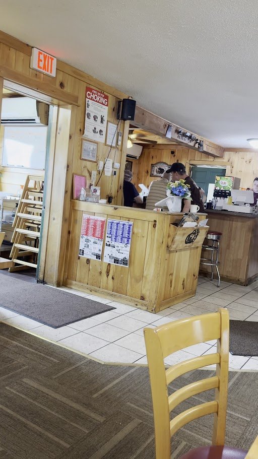Counter seating inside a cozy restaurant.