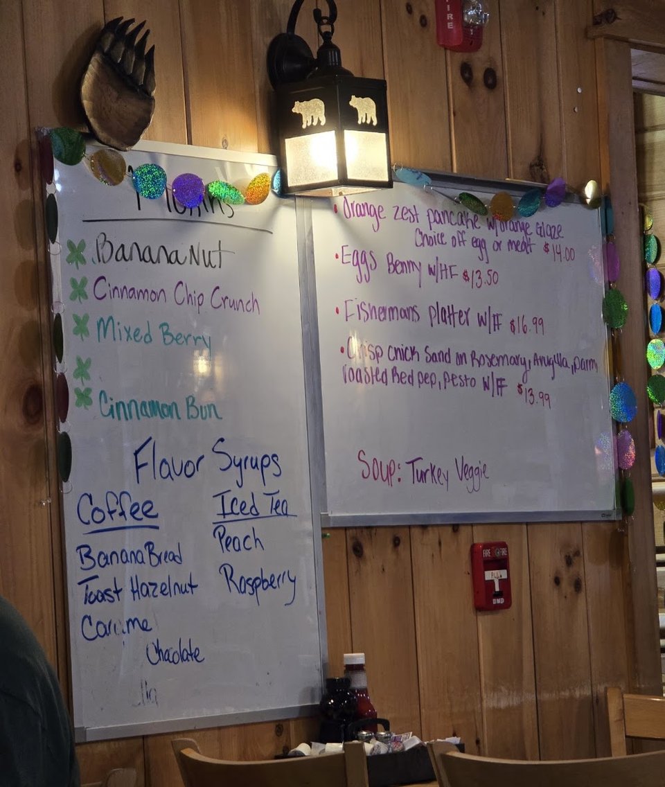 Printed menu showing burgers and salads.